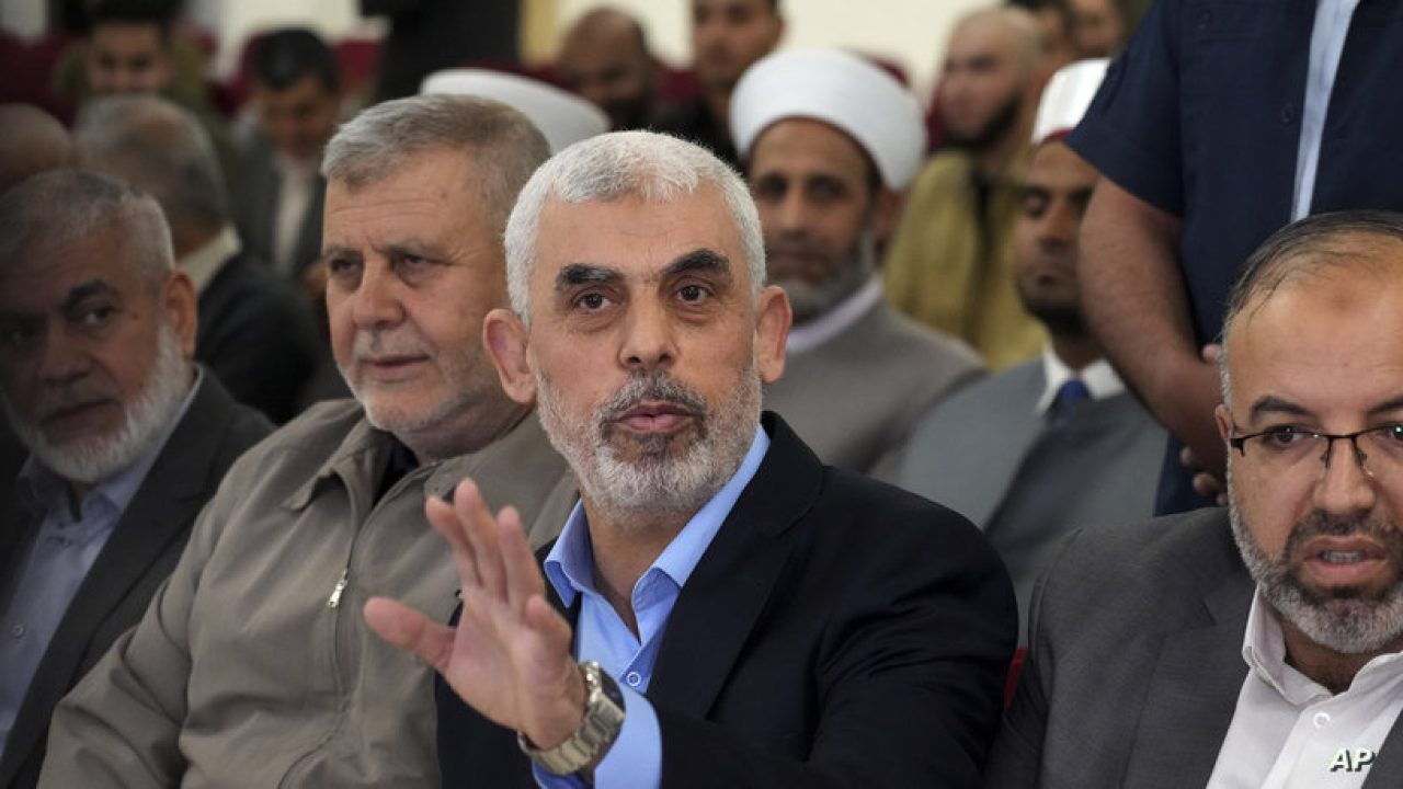 FILE - Yahya Sinwar, head of Hamas in Gaza, greets his supporters upon his arrival at a meeting in a hall on the sea side of Gaza City, on April 30, 2022. Since Hamas fighters carried out the deadliest attack on Israel in decades, Israeli officials have vowed to crush the Palestinian militant group and its enigmatic leader in Gaza, Yahya Sinwar. But seven weeks into the war, 61-year-old Sinwar remains alive, in hiding and at the helm of Hamas’ fighters as they battle Israeli forces. (AP Photo/Adel Hana, File)
