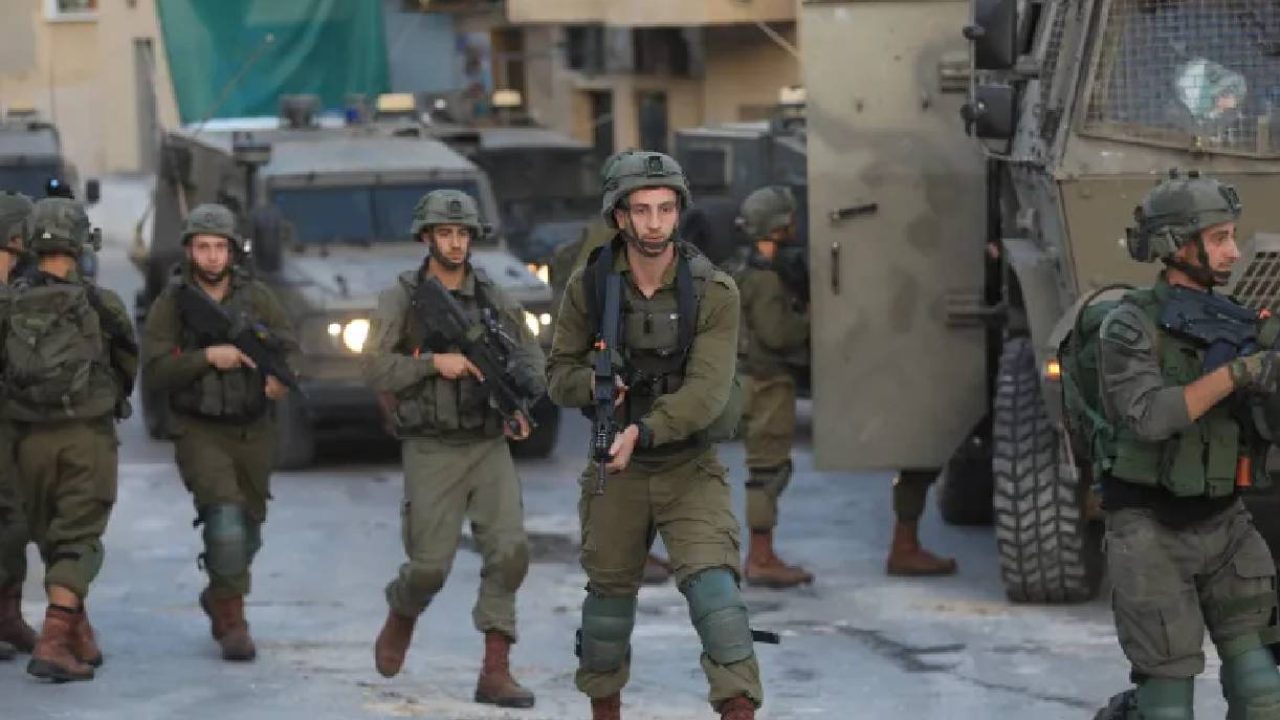 Israeli soldiers advancing in west bank