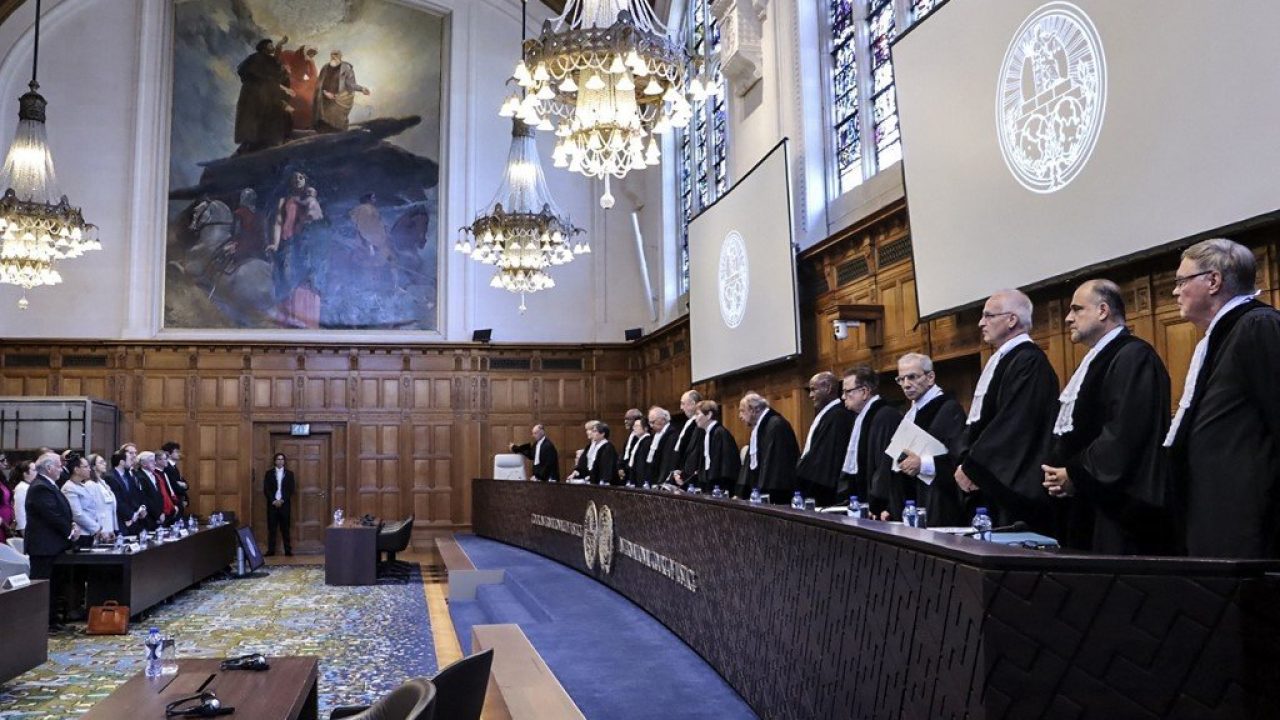 Handout picture released by the Colombian Foreign Ministry showing representatives of Colombia (L) and judges of the International Court of Justice (ICJ) standing before the UN's top court gives its verdict in the latest legal battle between Colombia and Nicaragua over an oil and fish-rich swathe of the Caribbean Sea, in The Hague on July 13, 2023. The UN's top court dismissed Nicaragua's claims against Colombia on July 13, 2023, in a decades-long Latin American legal battle over an oil- and fish-rich swathe of the Caribbean Sea. The International Court of Justice (ICJ) said it "rejects" Nicaragua's bid to improve an earlier 2012 ruling that gave it a large chunk of the Caribbean, while awarding seven small islands to Colombia. (Photo by Colombia's Ministry of Foreign Affairs / AFP) / RESTRICTED TO EDITORIAL USE - MANDATORY CREDIT "AFP PHOTO / COLOMBIAN FOREIGN MINISTRY" - NO MARKETING NO ADVERTISING CAMPAIGNS - DISTRIBUTED AS A SERVICE TO CLIENTS