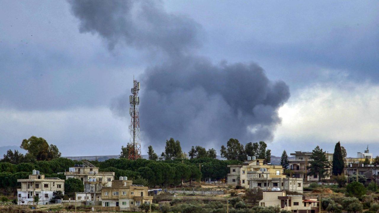 Smoke billows after Israeli bombardment near the village of Tair Harfa (foreground) on the outskirts of the villages of Marwahin and al-Bustan in southern Lebanon near the border with northern Israel on December 13, 2023. (Photo by AFP)