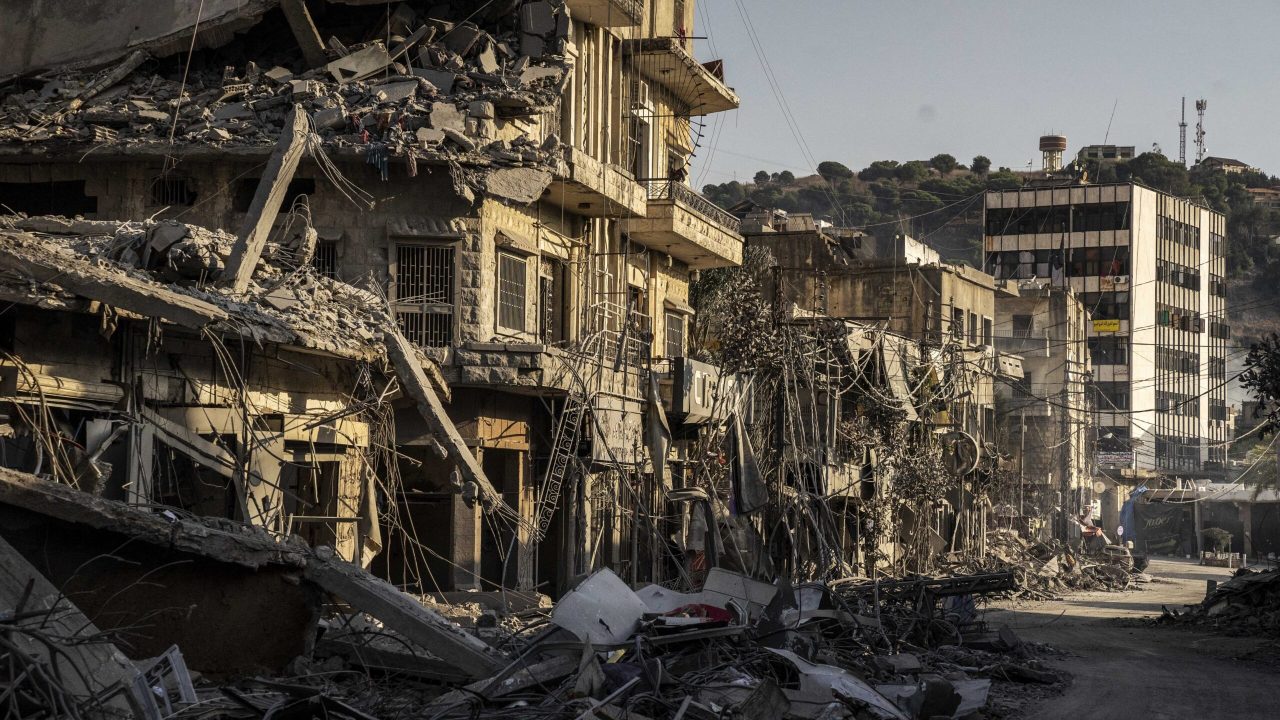 NABATIEH, LEBANON - OCTOBER 16: A view of damage as civil defense teams, along with local residents, mobilize to assist in the recovery efforts, working to clear the wreckage of the destroyed buildings and provide aid to those affected aftermath of Israeli attack on Nabatiah, Lebanon on October 16, 2024. After a six-day pause, the Israeli attacks resume to target Beirut, the capital of Lebanon. The latest airstrikes, particularly severe in the southern city of Nabatiyeh, reportedly resulted in numerous fatalities and injuries. The aftermath revealed significant destruction, with debris scattered throughout the area. Jose Colon / Anadolu (Photo by JOSE COLON / ANADOLU / Anadolu via AFP)