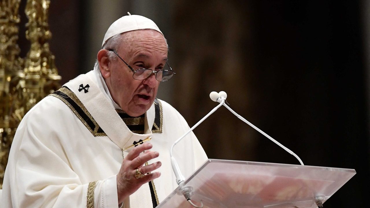 Pope Francis addresses the faithfuls during the Christmas Eve mass at St Peter's Basilica in the Vatican, on December 24, 2021. (Photo by Filippo MONTEFORTE / AFP)