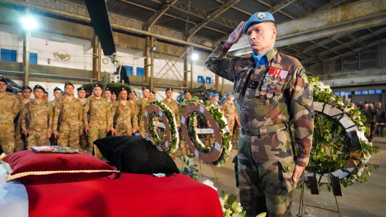 This handout photograph taken and released on April 19, 2026, by the United Nations Interim Force in Lebanon (UNIFIL), shows UNIFIL Chief of Staff and the senior-most French official in UNIFIL, Major General Paul Sanzey saluting the coffin of late French UNIFIL peacekeeper Sergeant-Chef Florian Montorio during a tribute ceremony on the tarmac of BeirutRafic Hariri International Airport prior to the repatriation of his mortal remains to France. French Sergeant Florian Montorio attached to the 17th Parachute Engineer Regiment in Montauban, in south-west France, was killed and three others wounded on April 18, 2026 in southern Lebanon during an ambush on UNIFIL peacekeepers. He is the second French soldier to be killed in the region's turmoil since the start of US and Israeli attacks against Iran in late February. (Photo by Handout / UNIFIL / AFP) / RESTRICTED TO EDITORIAL USE - MANDATORY CREDIT "AFP PHOTO / UNIFIL /HANDOUT / Haidar Fahs" - HANDOUT - NO MARKETING NO ADVERTISING CAMPAIGNS - DISTRIBUTED AS A SERVICE TO CLIENTS