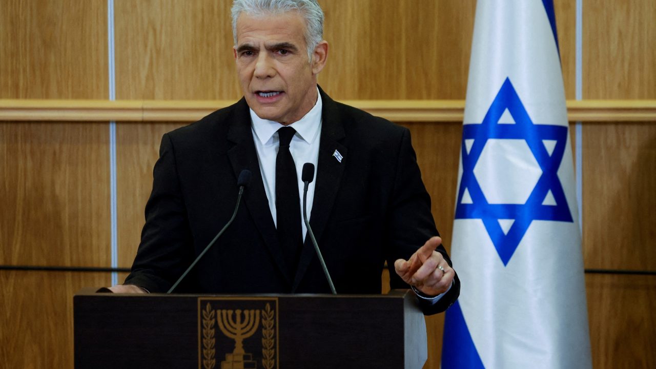 FILE PHOTO: Israeli opposition leader Yair Lapid delivers a statement at the Knesset, Israel's parliament, on the day Israel's constitution committee is set to start voting on changes that would give politicians more power on selecting judges while limiting Supreme Court powers to strike down legislation, in Jerusalem, February 13, 2023. REUTERS/Amir Cohen/File Photo