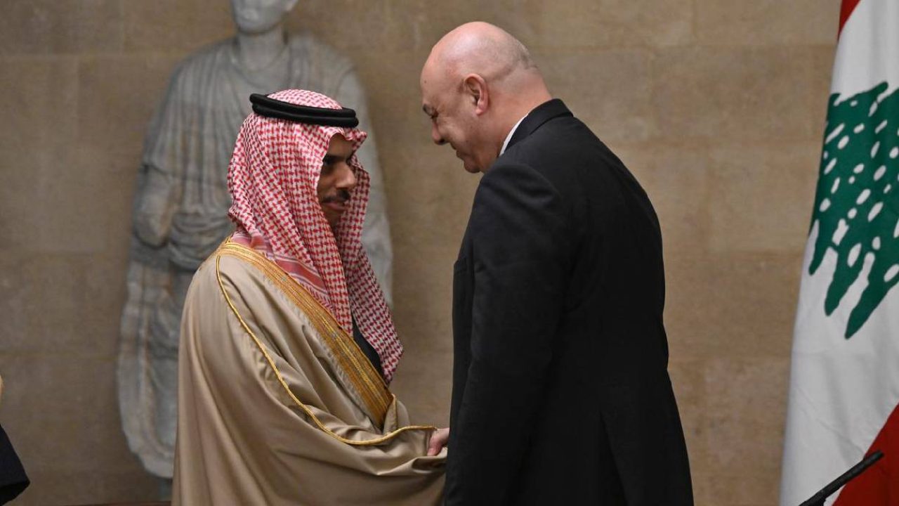 bin farhan and president aoun shaking hands