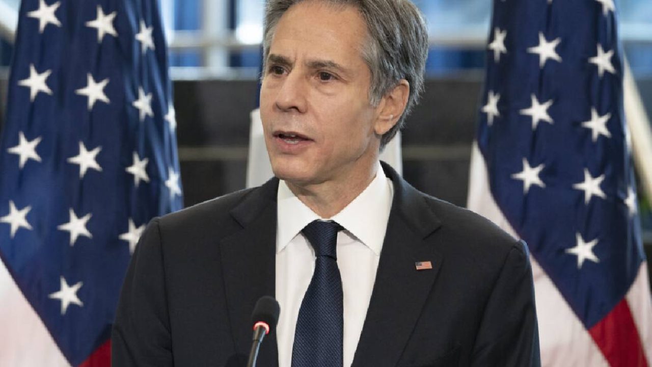 blinken with us flags