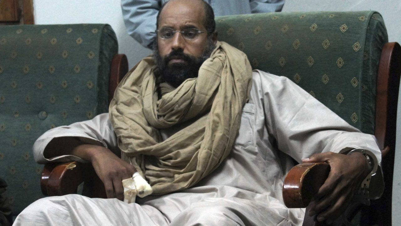 FILE - In this Nov. 19, 2011, file photo, Seif al-Islam is seen after his capture in the custody of revolutionary fighters in Zintan, a town south of the capital Tripoli, Libya. A statement by his captors, the Abu Bakr al-Siddiq Battalion, said Seif al-Islam was released on Friday, June 9, 2017, but gave no details on his whereabouts. They declined to disclose his whereabouts, citing concerns over his safety. (AP Photo/Ammar El-Darwish, File)