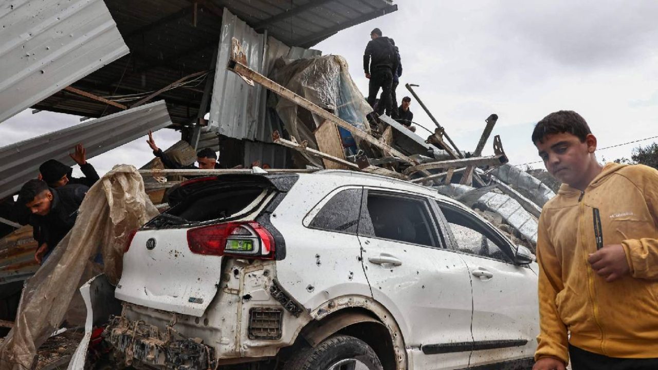 car and building destroyed in west bank