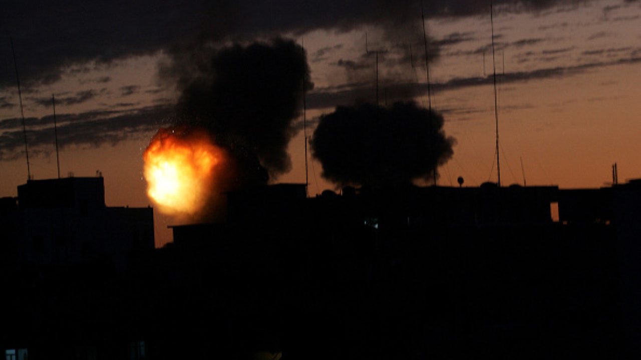 MIDEAST-ISRAEL-PALESTINIAN-CONFLICT-GAZA-TUNNELS A ball fire of explodes into the night sky following an Israel air strike on tunnels on Gaza's border with Egypt in Rafah on January 03, 2009. The Israeli military has carried out more than 700 strikes on Gaza since it launched a massive offensive on Hamas a week ago, killing at least 435 Palestinians, the army and medics said today. The raids by warplanes and naval vessels have targeted Hamas government buildings, the homes of Hamas officials, mosques alleged to have stored weapons and tunnels used to smuggle arms and goods into the territory that Israel has kept virtually sealed since Hamas seized power in June 2007. AFP PHOTO/SAID KHATIB (Photo by SAID KHATIB / AFP) (Photo by SAID KHATIB/AFP via Getty Images)