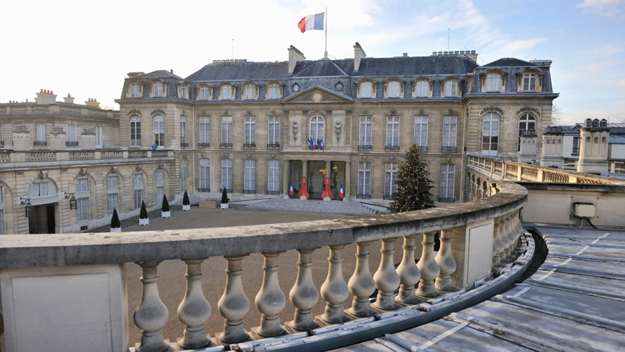 For the first time two large red ribbons are displayed on the columns of the Elysee presidential palace, on December 1, 2009 in Paris, to mark World AIDS Day, supporting a cause dear to first lady Carla Bruni-Sarkozy. The three-metre long (10 foot) ribbons were hung on the portico of President Nicolas Sarkozy's office and residence as his wife promoted the global campaign against AIDS in several media interviews. "Every year, there are new HIV infections in France and elsewhere in the world. We must remain mobilised to improve prevention of AIDS and care," said an Elysee statement. AFP PHOTO / ERIC FEFERBERG (Photo credit should read ERIC FEFERBERG/AFP/Getty Images)