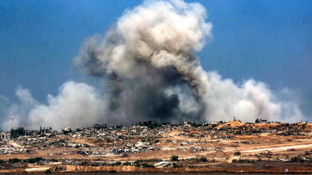 A plume of smoke erupts during Israeli bombardment in the Gaza Strip as pictured from across the border in southern Israel on June 5, 2025, amid the ongoing war between Israel and Hamas. Gaza's civil defence agency said Israeli strikes killed at least 10 people in the battered Palestinian territory on June 5 as the military keeps up an intensified offensive. (Photo by Jack GUEZ / AFP)