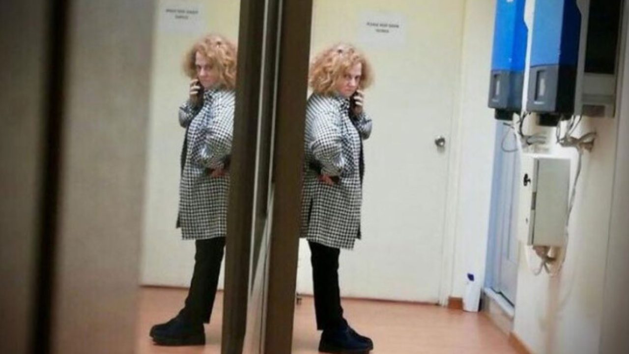 ghada-aoun-standing-talking-on-the-phone