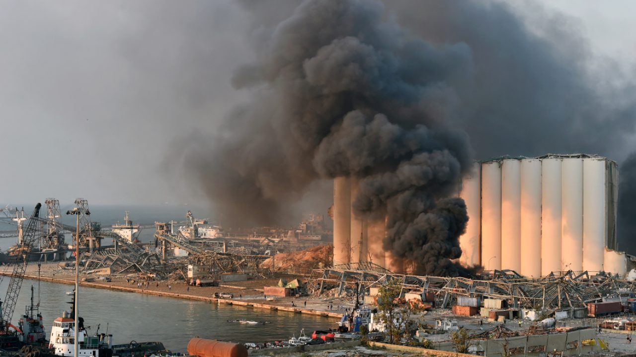 epa08583772 A general view of the harbor area with smoke billowing from an area of a large explosion, with damage and debris after a large explosion rocked the harbor area of Beirut, Lebanon, 04 August 2020. According to reports, several people have been injured and large area badly damaged while the cause of the explosion is not yet known.  EPA-EFE/WAEL HAMZEH