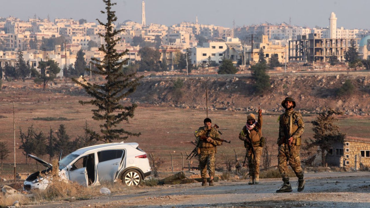Anti regime fighters hold a position in New Aleppo on the outskirts of the northern Syrian city of Aleppo on November 29, 2024. Jihadists and their Turkish-backed allies took control of five districts of Syria's second city of Aleppo on November 29, "without any significant pushback" from the Syrian military, a war monitor said. (Photo by Bakr ALKASEM / AFP)