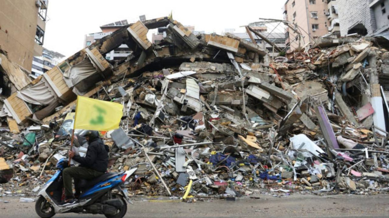 hezb flag next to destroyed building