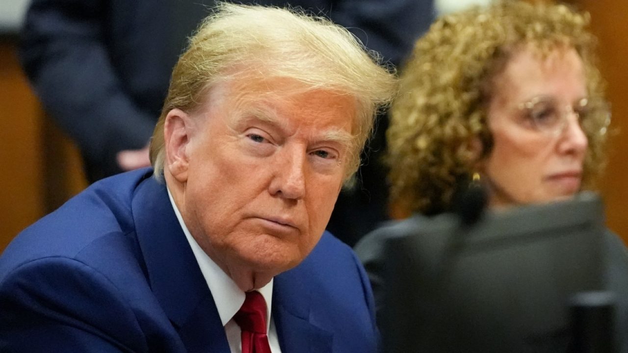 (L-R) Former US President Donald Trump and attorney Susan Necheles attend a hearing to determine the date of his trial for allegedly covering up hush money payments linked to extramarital affairs, at Manhattan Criminal Court in New York City on March 25, 2024. Trump faces twin legal crises today in New York, where he could see the possible seizure of his storied properties over a massive fine as he separately fights to delay a criminal trial even further. (Photo by Mary Altaffer / POOL / AFP)