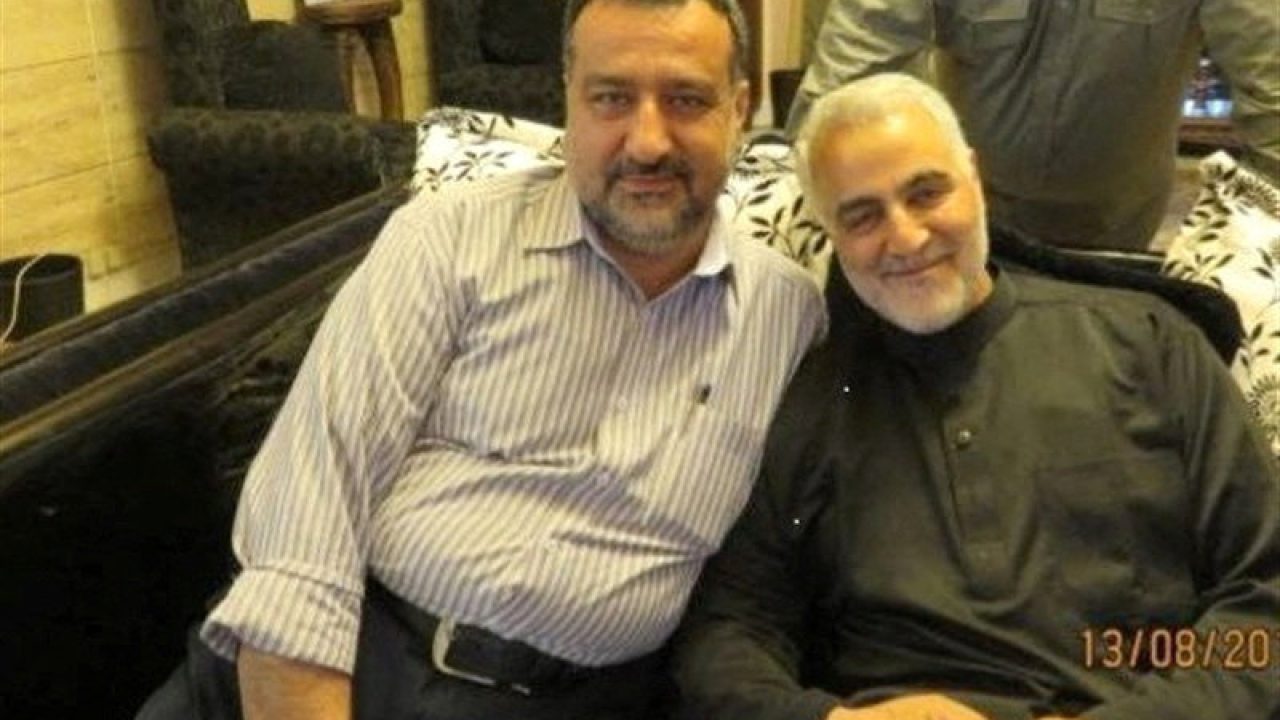 Senior adviser for Iran's Islamic Revolutionary Guard Corps, Sayyed Razi Mousavi, sits next to late Iranian Major-General Qasem Soleimani in an unknown location, in this handout image obtained on December 25, 2023.  Tasnim News/WANA (West Asia News Agency)/Handout via REUTERS ATTENTION EDITORS - THIS PICTURE WAS PROVIDED BY A THIRD PARTY.