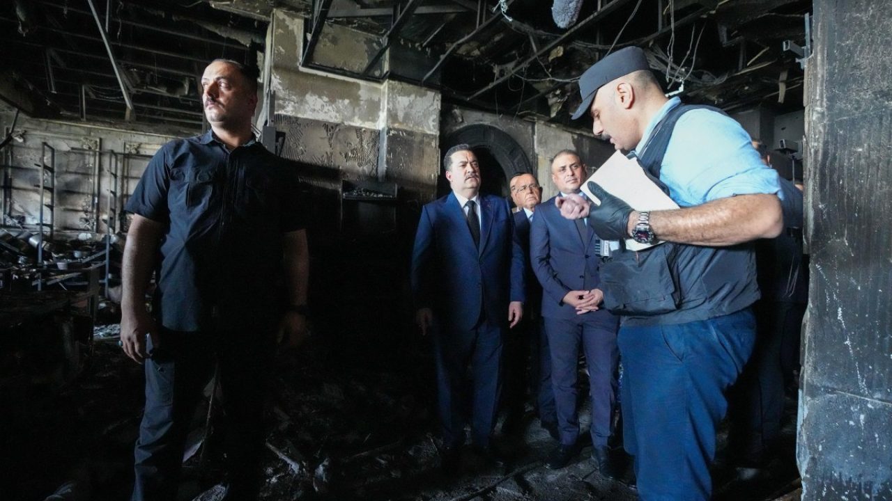 A handout picture released by Iraq's Prime Minister's Media Office shows Prime Minister Mohammed Shia al-Sudani (C) inspecting the damage during a visit to the Corniche Hypermarket Mall in the city of Kut on July 17, 2025, after a fire tore through the newly opened mall killing at least 61 people. (Photo by IRAQI PRIME MINISTER'S PRESS OFFICE / AFP) / === RESTRICTED TO EDITORIAL USE - MANDATORY CREDIT "AFP PHOTO / HO / IRAQI PRIME MINISTER'S PRESS OFFICE" - NO MARKETING NO ADVERTISING CAMPAIGNS - DISTRIBUTED AS A SERVICE TO CLIENTS ===