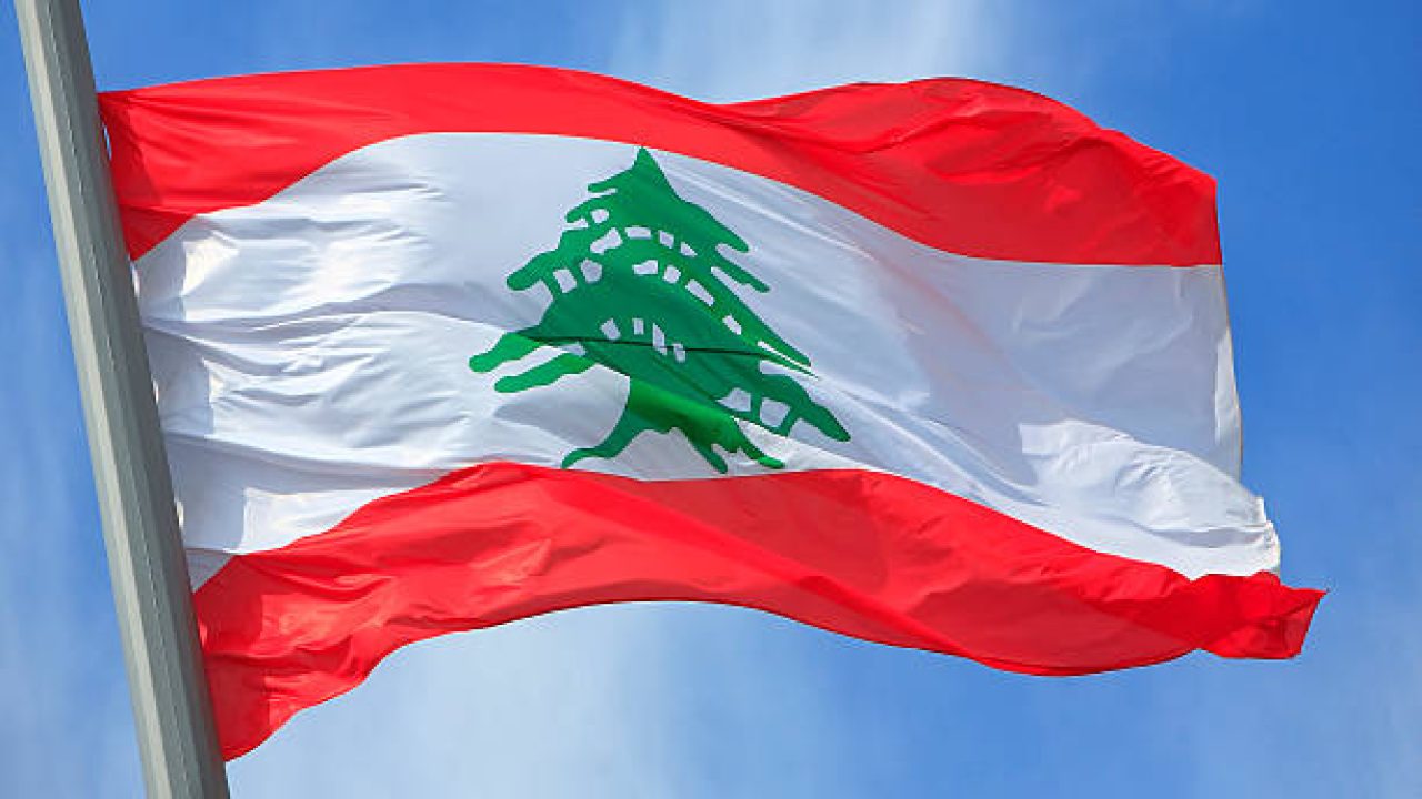 The Lebanese flag against the blue sky The Lebanese flag against the blue sky