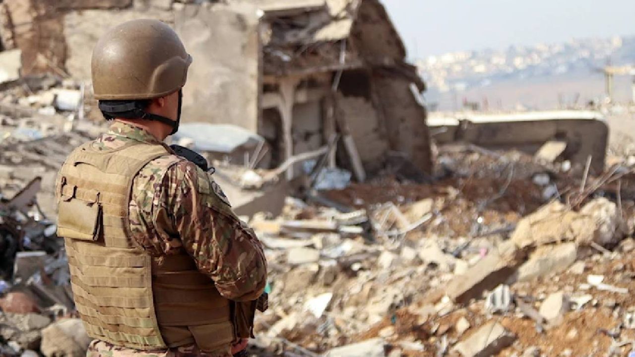 leb army soldier looking at destruction