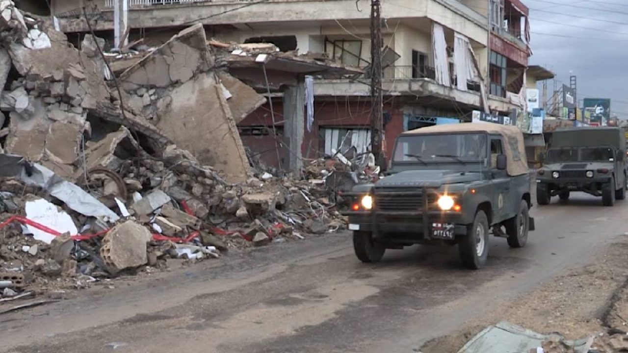 leb army trucks amidst ruins