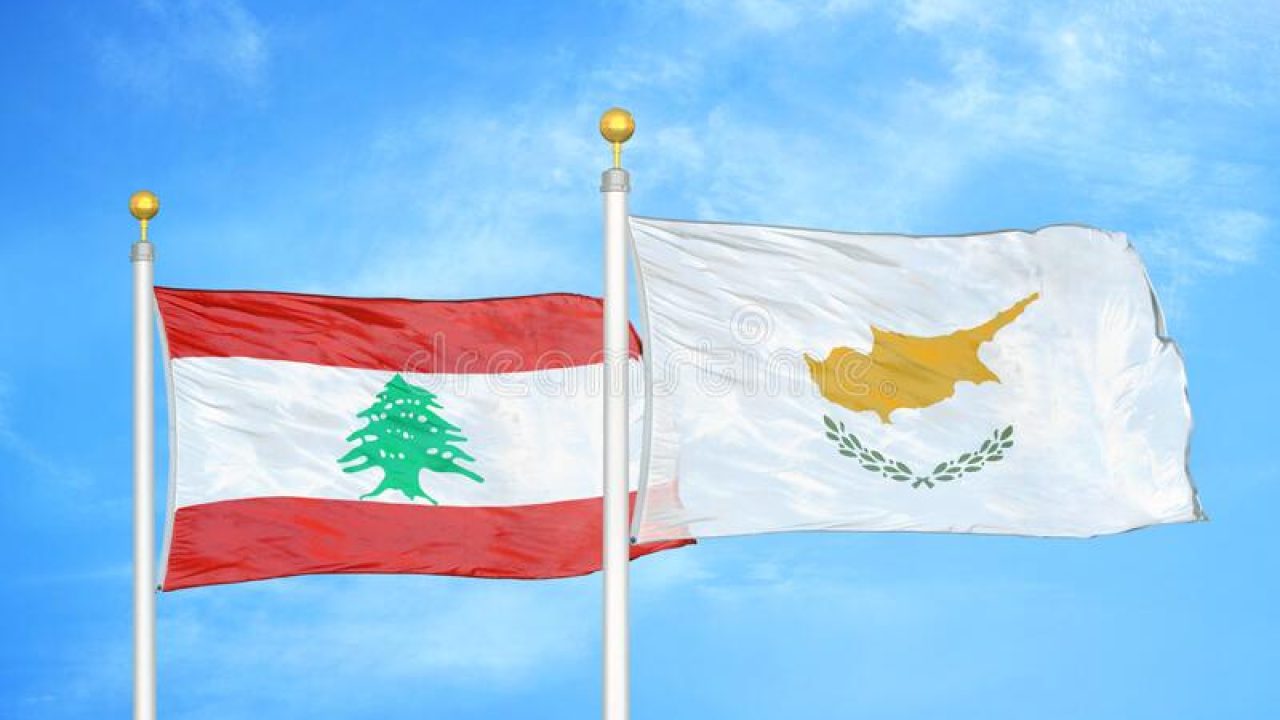 lebanon-cyprus-two-flags-flagpoles-blue-cloudy-sky-background-178663763