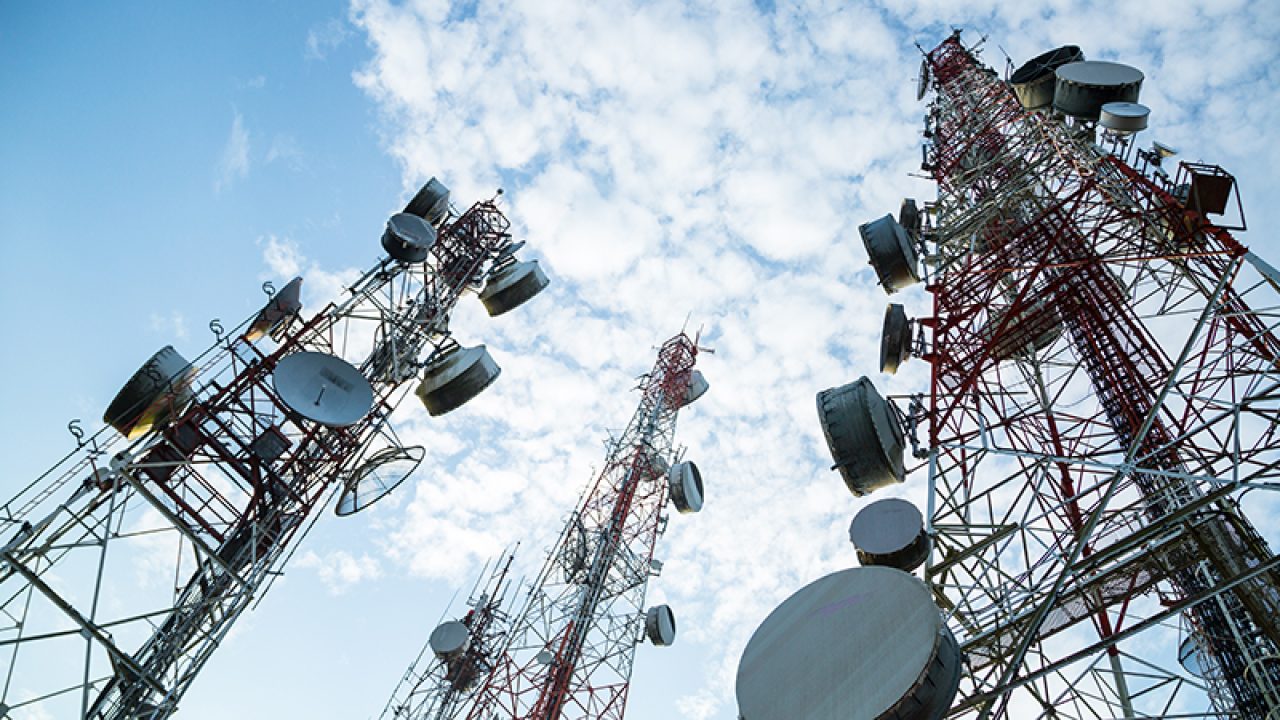 Telecommunication mast TV antennas wireless technology with blue sky in the morning