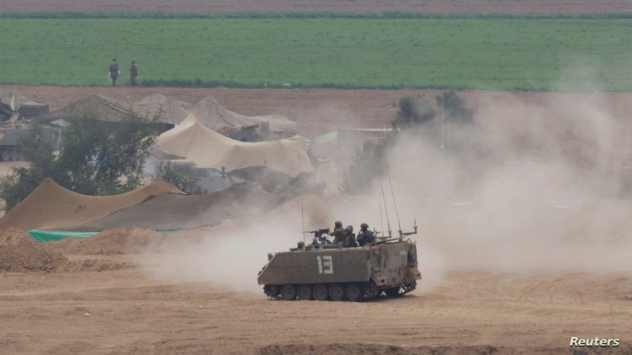 Israeli soldiers are seen on top of an Armoured Personnel Carrier (APC), near the Israel-Gaza border Israeli soldiers are seen on top of an Armoured Personnel Carrier (APC), as the conflict between Israel and the Palestinian Islamist group Hamas continues, near the Israel-Gaza border, in Israel October 29, 2023 REUTERS/Evelyn Hockstein