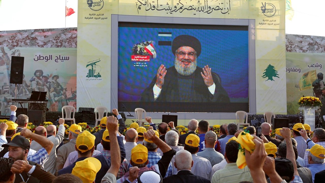 Lebanon's Hezbollah leader Sayyed Hassan Nasrallah gestures as he addresses his supporters via a screen during a rally marking the anniversary of the defeat of militants near the Lebanese-Syrian border, in al-Ain village Lebanon's Hezbollah leader Sayyed Hassan Nasrallah gestures as he addresses his supporters via a screen during a rally marking the anniversary of the defeat of militants near the Lebanese-Syrian border, in al-Ain village, Lebanon August 25, 2019. REUTERS/Aziz Taher
