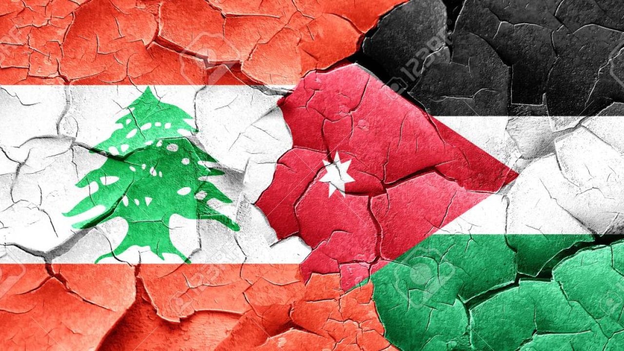 Lebanon flag with Jordan flag on a grunge cracked wall