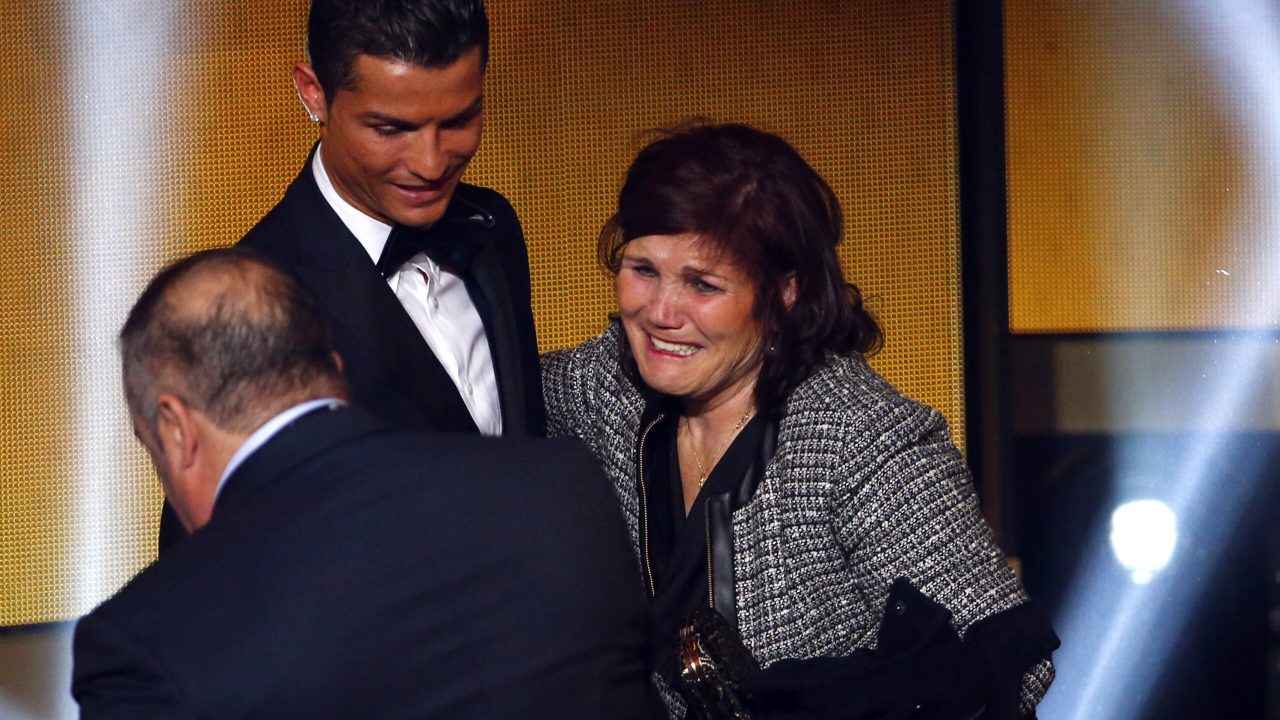 Maria Dolores dos Santos Aveiro, the mother of FIFA Ballon d'Or winner Cristiano Ronaldo, hugs her son after the FIFA Ballon d'Or 2014 soccer awards ceremony at the Kongresshaus in Zurich January 12, 2015. Ronaldo, who won the award for the second time in a row and third overall, was voted ahead of Argentina forward Lionel Messi and Germany goalkeeper Manuel Neuer in the annual poll. REUTERS/Ruben Sprich (SWITZERLAND  - Tags: SPORT SOCCER)