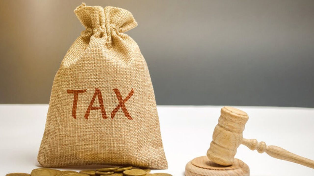 rsz-bigstock-bag-of-money-and-the-word-tax-275040682