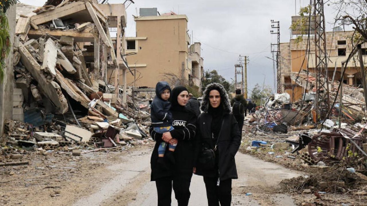 south - people walking amid destruction