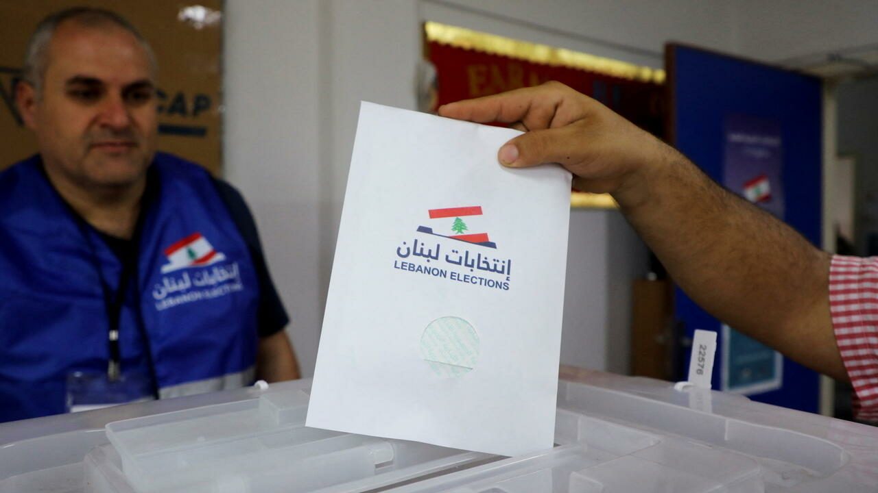 A man casts his vote in the Lebanese parliamentary election, at a polling station in Beirut, Lebanon May 15, 2022. REUTERS/Mohamed Azakir