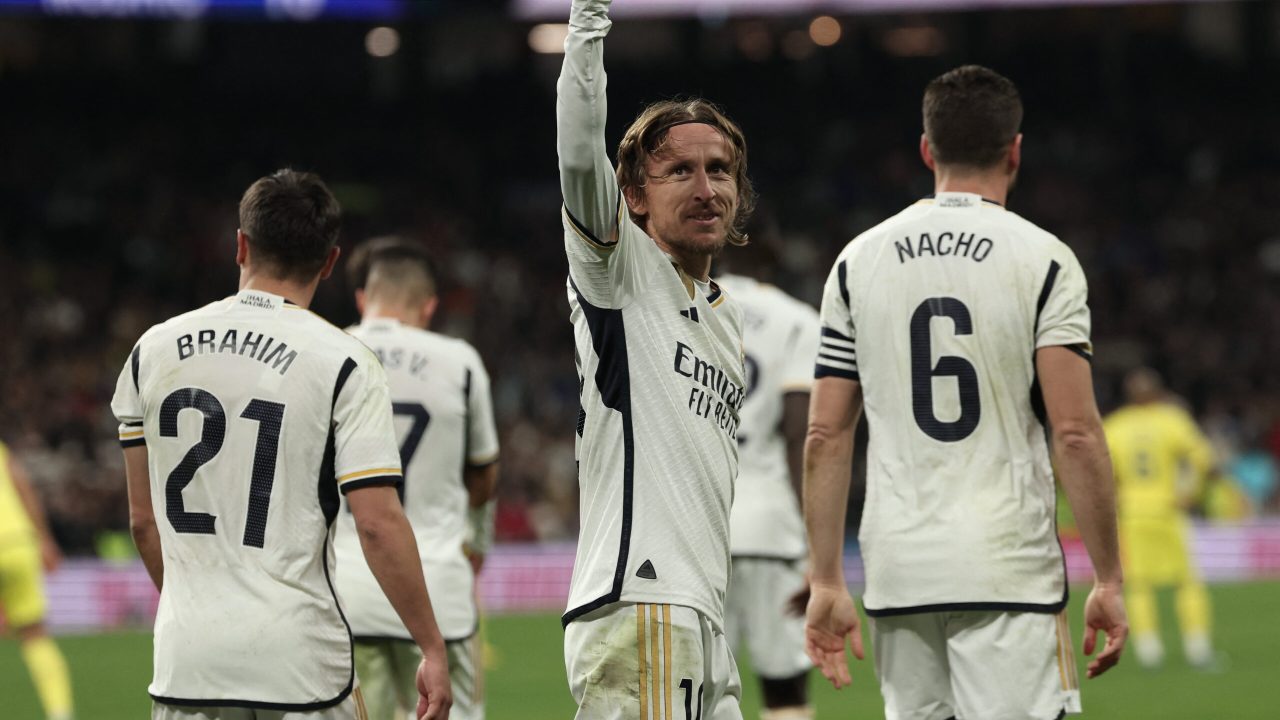 Real Madrid's Croatian midfielder #10 Luka Modric celebrates scoring his team's fourth goal during the Spanish league football match between Real Madrid CF and Villarreal CF at the Santiago Bernabeu stadium in Madrid on December 17, 2023. (Photo by Thomas COEX / AFP)