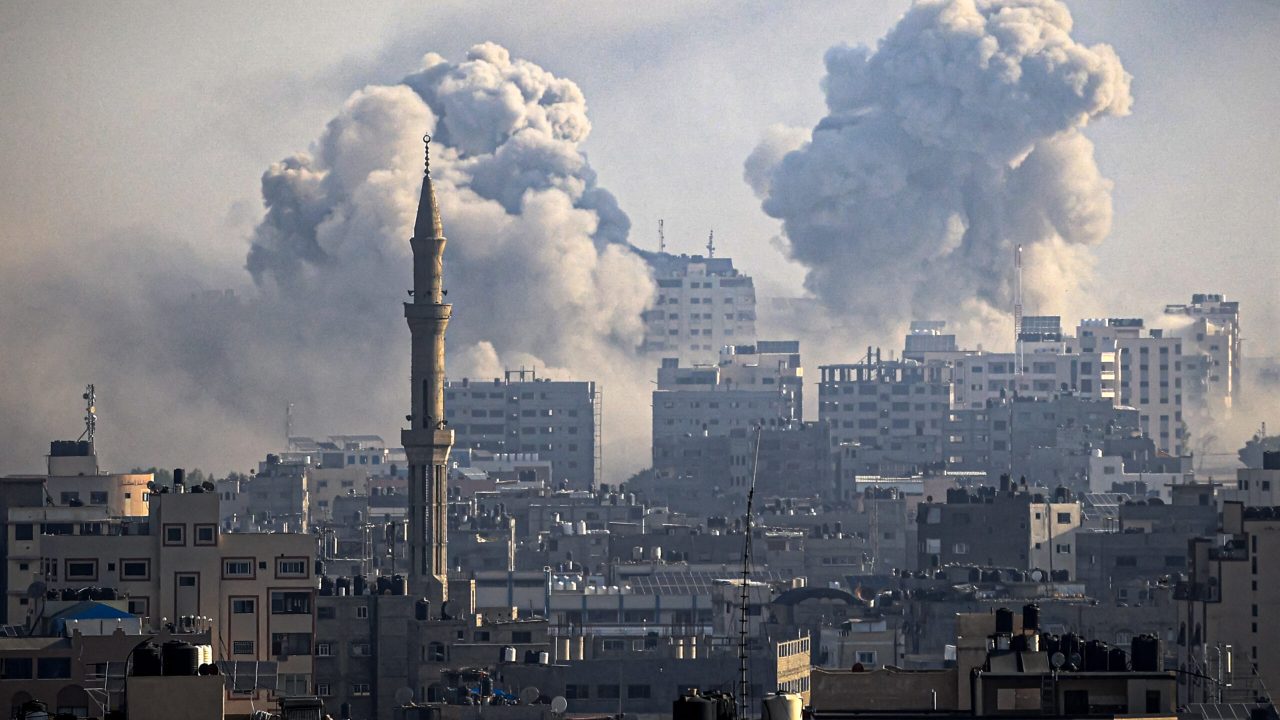 Smoke plumes billow during Israeli air strikes in Gaza City on October 12, 2023 as raging battles between Israel and the Hamas movement continue for the sixth consecutive day. Washington urged Israel to show restraint in its response to Hamas's surprise attack -- the worst in the country's 75-year history -- which Israeli forces said killed more than 1,200 people, mostly civilians. In Gaza, officials have reported more than 1,200 people killed in Israel's uninterrupted campaign of air and artillery strikes, while the UN said more than 338,000 people have been displaced. (Photo by IBRAHIM HAMS / AFP)